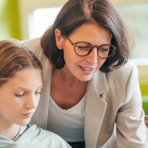 Teacher working with student